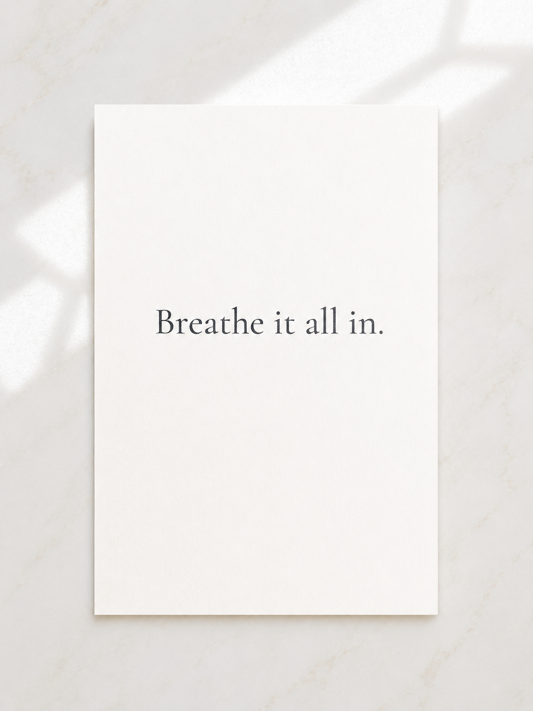 White card with 'Breathe it all in.' text on a light background